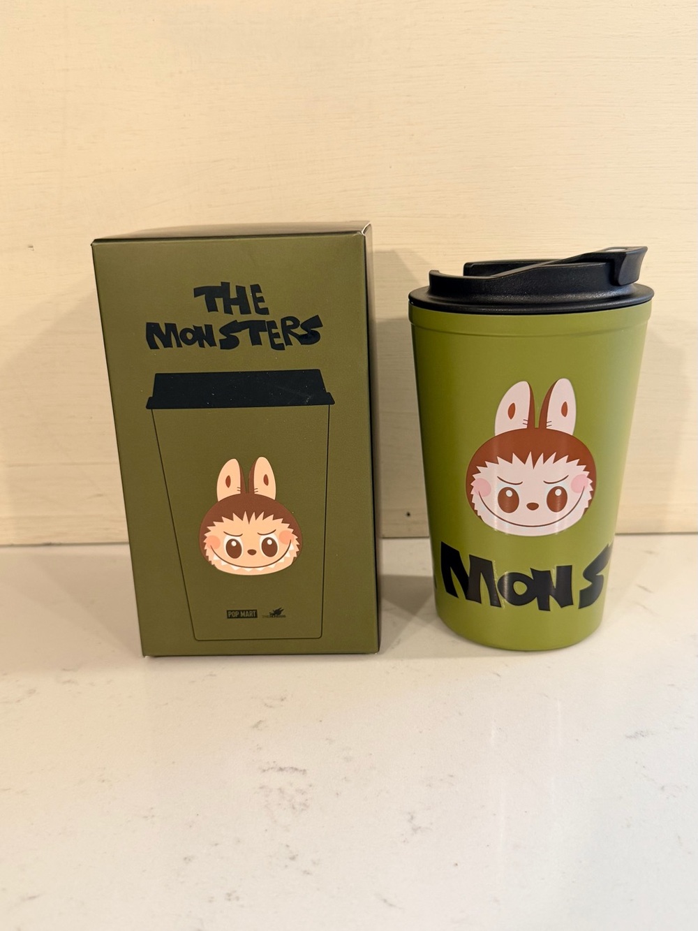 The Monsters Olive Green Travel Mug with Character Graphic
